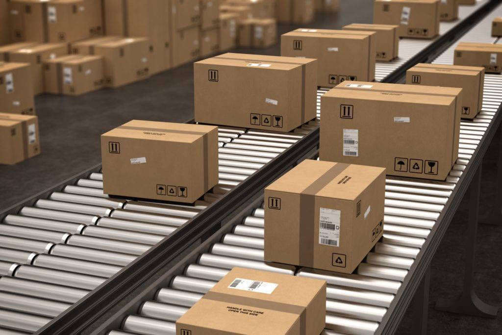 Closed cardboard boxes and wrapped with adhesive on conveyor roller